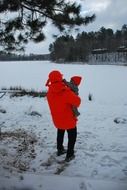 dad and baby for a walk in winter