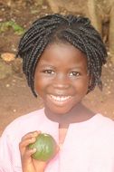 african girl with lime in her hand