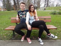 girl and boy in the Park on the bench