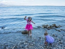 children on a pebble beach