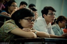 students at their desks listening to a lecture