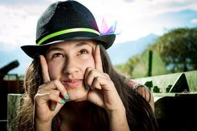 portrait of a girl wearing black hat