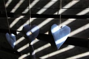 blue hearts at wooden wall, shadow play