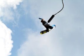 man on a bungee snowboard