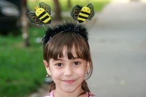 Portrait of the girl with the band with the bees