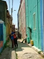 girl and boy in love at narrow street