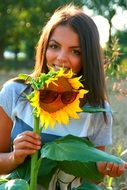 girl posing with sunflower