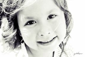 Black and white portrait of smiling girl