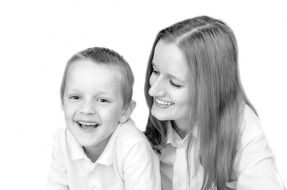 black and white portrait of a boy with mother