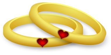 gold rings with red hearts