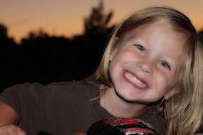 portrait of the happy boy in the evening