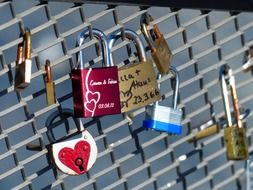 A variety of locks of love on the fence