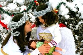 two little girls at christmas decoration