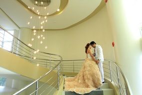 newlyweds on the hotel stairs