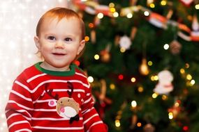 happy little boy near the new year tree