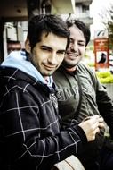 two young men laugh