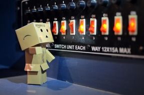 danbo stands near computer switches