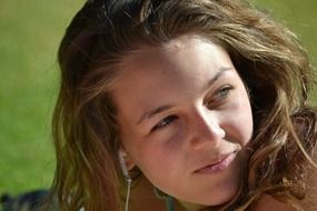 Girl with blue eyes in summertime