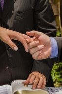 newlyweds hands on wedding