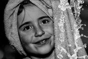 smiling girl face in towel on haed portrait