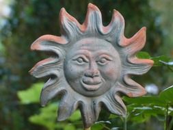 ceramic sun in the garden