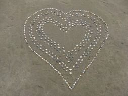 hearts of small pebbles on the ground