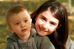 portrait of smiling brother and sister