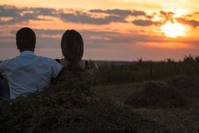 beautiful couple admire the sunset