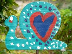 painted wooden snail outdoor