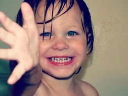 Portrait of young girl at bath time