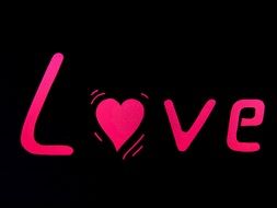 pink text LOVE on a black background