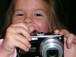 Girl is taking the photo with camera
