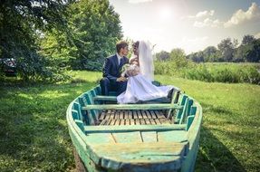 newlyweds in a wooden boat