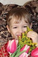 boy with a bouquet of tulips in his hands