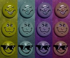 different emoticons on a colorful background