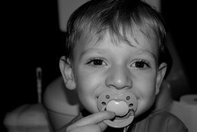 photo of a boy with a dummy