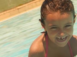 smiling girl in the pool