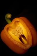 sliced pepper on a black background