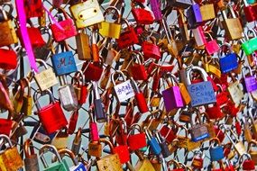 colorful locks on a fence