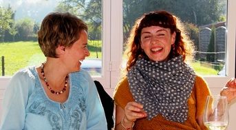 cheerful women at the table