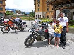 thai family with bikers