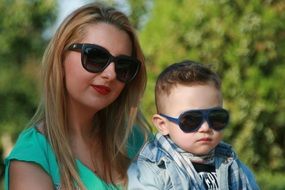 caucasian woman and small boy in sunglasses