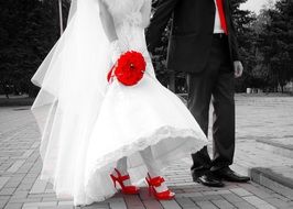 white wedding dress and red shoes