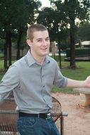 teenager in jeans and shirt