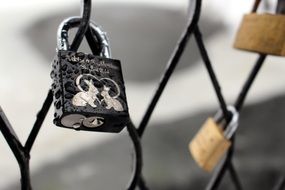 love lock with pair of rabbits on fence, norway, oslo