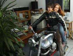 Boy with girlfriend on the motorcycle