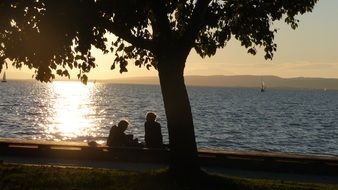 couple near the water at sunset