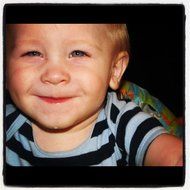 smiling boy in a striped t-shirt