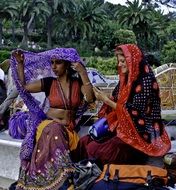 Oriental women in traditional clothes in Barcelona