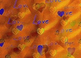 love word with hearts on orange background